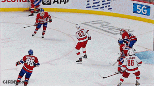 A Hockey Player With The Number 86 On His Jersey Celebrates His Goal GIF