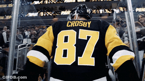 A Hockey Player With The Number 87 On His Back GIF