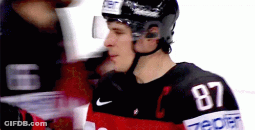 A Hockey Player With The Number 87 On His Shirt GIF