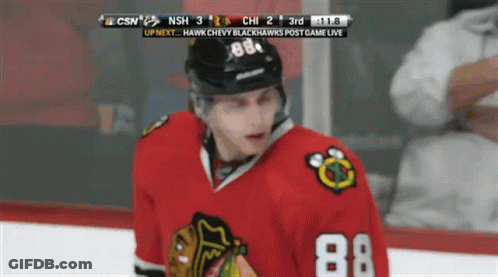 A Hockey Player With The Number 88 On His Jersey Stands On The Ice GIF