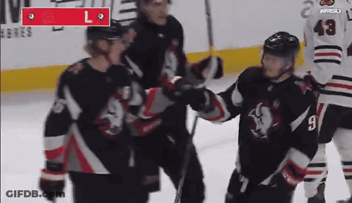 A Hockey Player With The Number 9 On His Jersey Stands On The Ice GIF