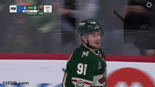 A Hockey Player With The Number 91 On His Jersey Stands On The Ice GIF