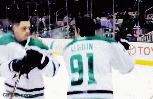 A Hockey Player With The Number 91 On Their Back GIF