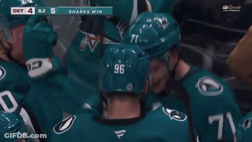 A Hockey Player With The Number 96 On His Helmet Is Surrounded By Other Players GIF