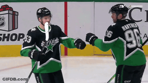 A Hockey Player With The Number 96 On The Back Of His Jersey Shakes Hands With Another Player GIF