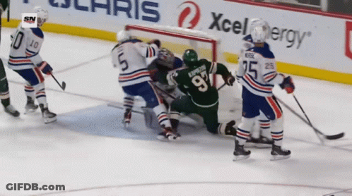 A Hockey Player With The Number 97 On His Jersey GIF