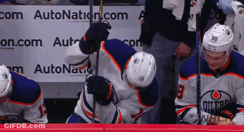 A Hockey Player With The Number 98 On Their Jersey GIF