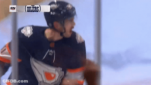 A Hockey Player With The Word Oilers On His Shirt GIF