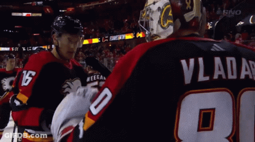 A Hockey Player With Vladar On His Back GIF