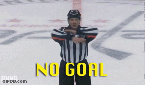 A Hockey Referee With His Arms Outstretched And The Words No Goal Behind Him GIF