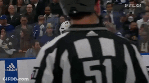 A Hockey Referee With The Number 51 On His Shirt GIF