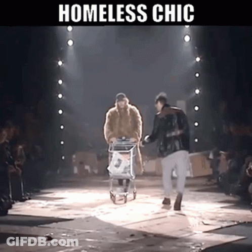 A Homeless Man Pushing A Shopping Cart Down A Runway GIF