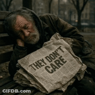 A Homeless Man Sleeping On A Bench With A Newspaper That Says They Don 'T Care GIF