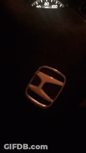 A Honda Emblem Sits Next To The Speedometer GIF