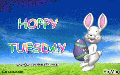 A Hoppy Tuesday Greeting Card With A Bunny Holding An Egg GIF