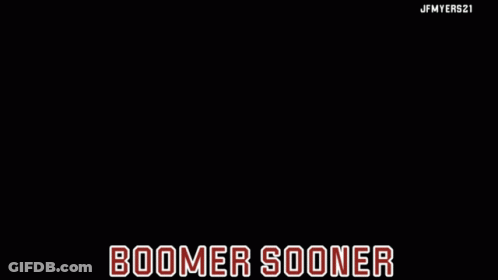 A Horse Drawn Carriage On A Field With The Words Boomer Sooner On The Bottom GIF