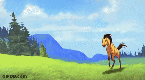 A Horse Is Running In A Grassy Field With Mountains In The Background . GIF