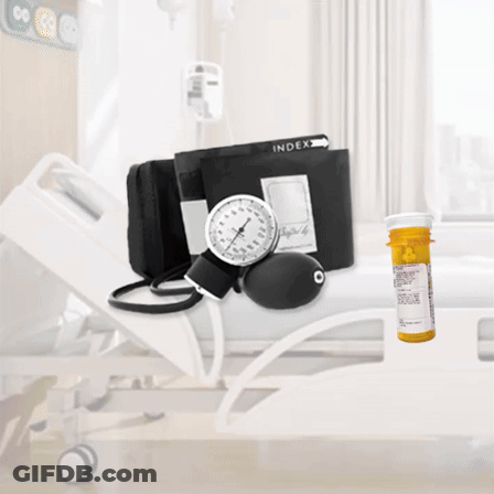 A Hospital Bed With A Bottle Of Medication And A Blood Pressure Monitor GIF