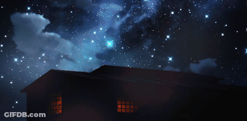 A House Is Lit Up At Night With A Starry Sky Behind It GIF