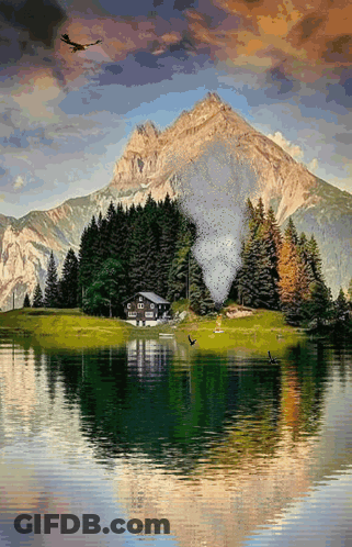 A House On A Small Island In The Middle Of A Lake With Mountains In The Background GIF