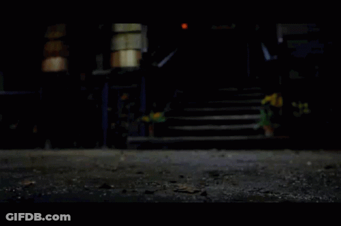 A House With Stairs And A Fence At Night GIF