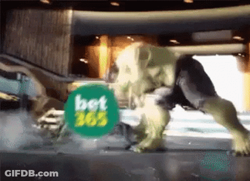 A Hulk Is Standing In Front Of A Bet Advertisement GIF