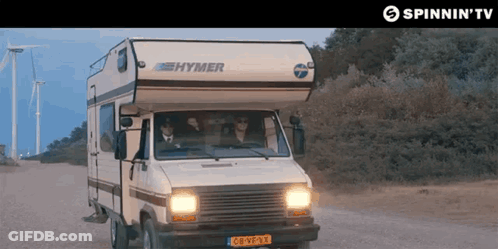 A Hymer Camper Is Driving Down A Dirt Road GIF