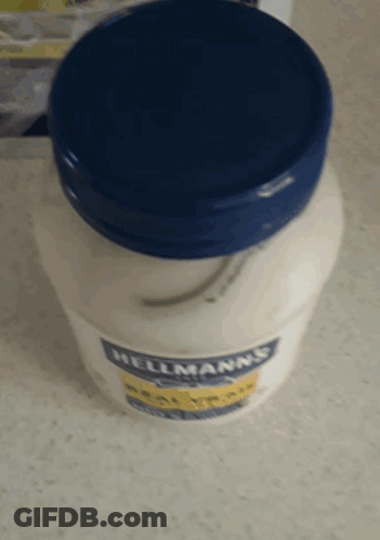 A Jar Of Hellmann 'S Mayonnaise Sits On A Table GIF