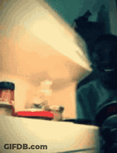 A Jar Of Strawberry Jam Sits On A Shelf GIF