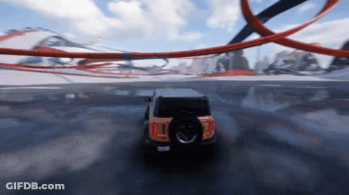 A Jeep Is Driving Down A Road With A Tire That Says ' I ' On It GIF