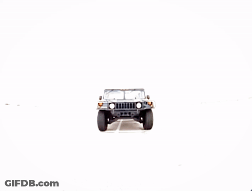 A Jeep Is Parked On A Gravel Road GIF