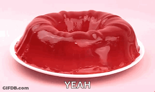 A Jelly Cake On A White Plate With The Word Yeah Written On It GIF