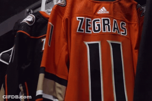 A Jersey That Says Zegras 11 On It GIF