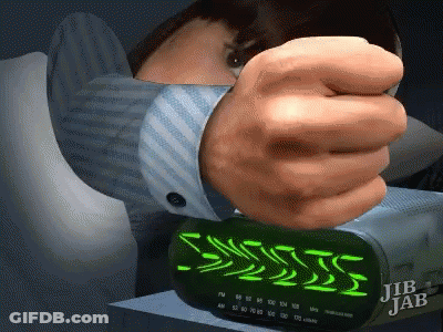 A Jib Jab Alarm Clock Is Being Turned On By A Man GIF