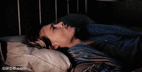 A Johnny Depp Gif Is Shown Of A Man Laying In A Bed GIF