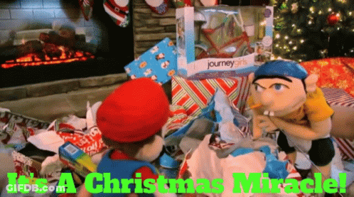 A Journey Girls Doll Is In A Pile Of Presents GIF