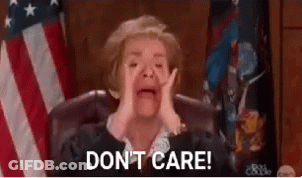 A Judge Is Crying While Sitting In Front Of An American Flag And Says `` Do N't Care '' . GIF
