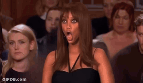 A Judge Is Holding A Piece Of Paper With A Picture Of A Woman On It GIF