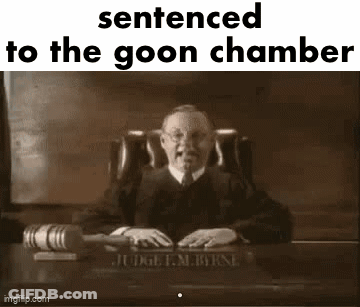A Judge Is Sitting At A Desk In A Courtroom Holding A Gavel And A Book . GIF