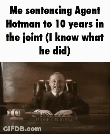 A Judge Is Sitting At A Desk In A Courtroom With A Gavel . GIF