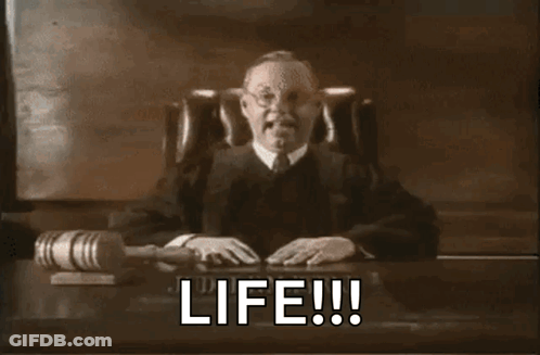 A Judge Is Sitting At A Desk With A Gavel And The Words Life Written On It GIF