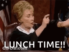 A Judge Is Sitting At A Table And Pointing At Someone While Saying Lunch Time . GIF