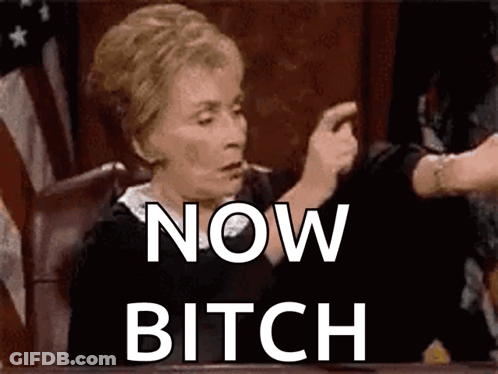 A Judge Is Sitting At A Table With The Words Now Bitch Written On The Screen . GIF
