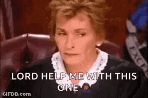 A Judge Is Sitting In A Courtroom With A Serious Look On Her Face . GIF