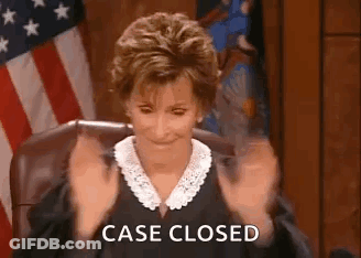 A Judge Is Sitting In A Courtroom With Her Hands In The Air And The Words `` Case Closed '' . GIF