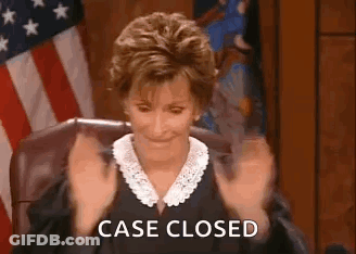 A Judge Is Sitting In A Courtroom With Her Hands In The Air And The Words `` Case Closed '' Written On The Screen . GIF