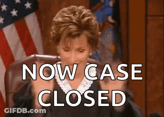 A Judge Is Sitting In A Courtroom With The Words `` Now Case Closed '' Written On The Screen Behind Her . GIF