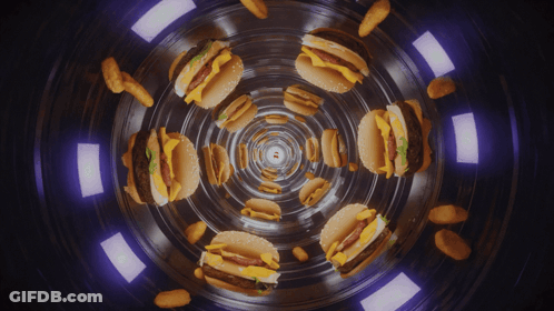 A Kaleidoscope Of Hamburgers And Nuggets In A Dark Tunnel GIF