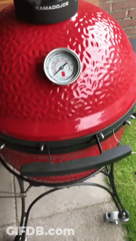 A Kamado Joe Grill With A Thermometer On Top GIF