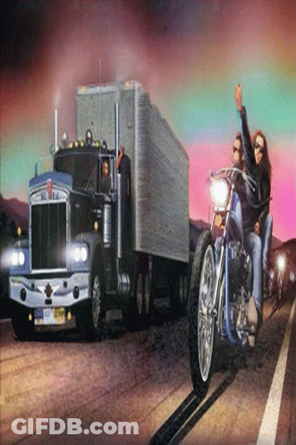 A Kenworth Semi Truck Is Driving Down The Road GIF